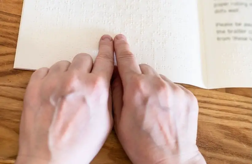 Point-of-View Female Fingers Reading with Braille