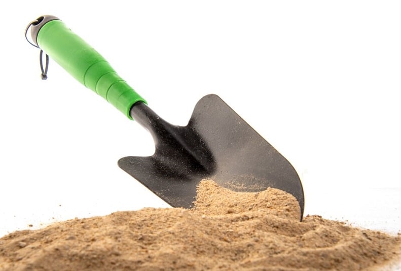Green Spade in Sand for Gardening
